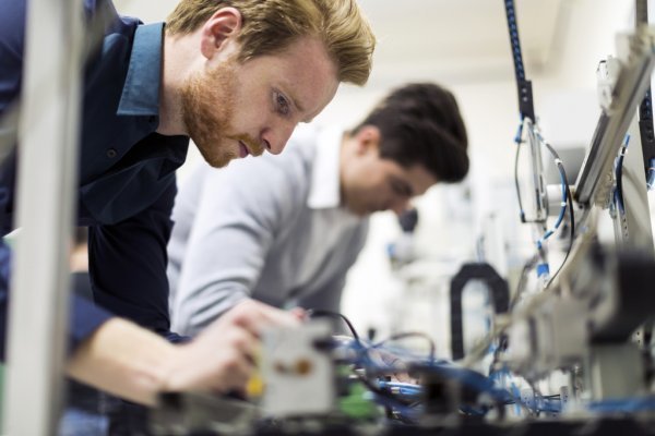 depositphotos_81268278-stock-photo-engineers-working-on-electronics-components.jpg